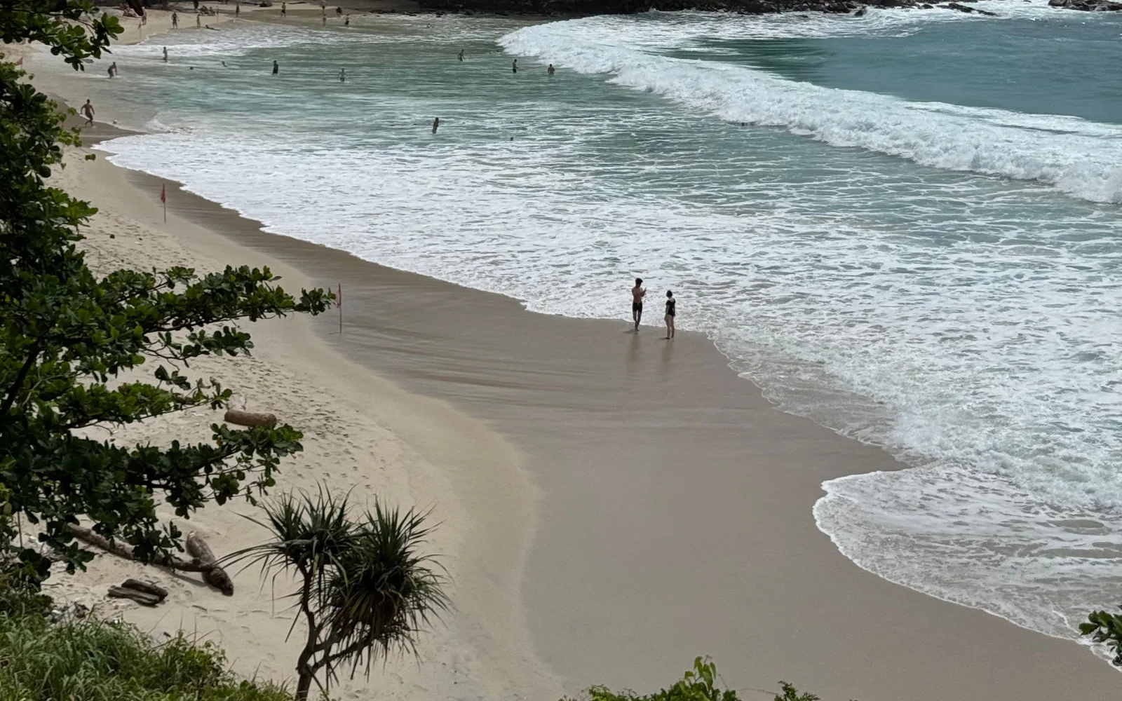 Kata Noi Beach in Phuket, green hills running down to the water